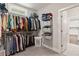 Walk-in closet with shelving and rod system for storage and organization at 435 Webb Dr, Norcross, GA 30071