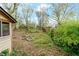 Landscaped backyard featuring mature trees, green shrubbery, and shed with view to sky at 1388 Metropolitan Se Ave, Atlanta, GA 30316