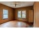 Bedroom with hardwood floors, natural light from two windows, and a ceiling fan at 1388 Metropolitan Se Ave, Atlanta, GA 30316