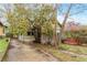 Lovely home featuring driveway, mature trees, and flowering bushes at 1388 Metropolitan Se Ave, Atlanta, GA 30316