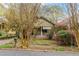 Charming home with a covered porch and mature trees in the front yard at 1388 Metropolitan Se Ave, Atlanta, GA 30316