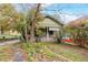 Curb view of charming home with covered front porch surrounded by foliage at 1388 Metropolitan Se Ave, Atlanta, GA 30316