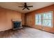 Cozy living room featuring hardwood floors, fireplace, and natural light from windows at 1388 Metropolitan Se Ave, Atlanta, GA 30316