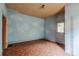 Room featuring a cloud motif, a vintage ceiling, worn floors, and natural light from the window at 1388 Metropolitan Se Ave, Atlanta, GA 30316