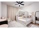 Bright bedroom featuring unique house frame bed, neutral color palette, and playful decor at 423 Burton Dr, Alpharetta, GA 30009