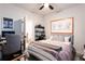 Bedroom features neutral tones, contemporary art and a large upholstered bed at 423 Burton Dr, Alpharetta, GA 30009