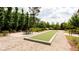 Enjoy bocce ball at the on-site court with grilling area, picnic table and manicured landscaping in the community at 423 Burton Dr, Alpharetta, GA 30009