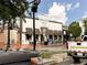 Street view of Smokejack Restaurant with brick and white facade, with street and traffic lights in view at 423 Burton Dr, Alpharetta, GA 30009