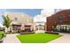 Enjoy outdoor dining and relaxing at The Maxwell's community green in a lively outdoor setting at 423 Burton Dr, Alpharetta, GA 30009