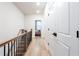 Hallway with hardwood floors leading to bedrooms and closet at 423 Burton Dr, Alpharetta, GA 30009
