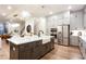 Gourmet kitchen with island, stainless appliances, custom cabinets and farmhouse sink at 423 Burton Dr, Alpharetta, GA 30009