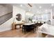 Open-concept living and dining area featuring hardwood floors and modern lighting at 423 Burton Dr, Alpharetta, GA 30009
