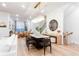 Bright living room with hardwood floors, white sofas, and an open floor plan to the kitchen and dining area at 423 Burton Dr, Alpharetta, GA 30009