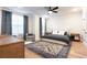 Spacious main bedroom with plush carpet, windows, ceiling fan, and ensuite bathroom at 423 Burton Dr, Alpharetta, GA 30009