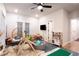 Bright playroom featuring a swing chair, a kitchen, and plenty of play space for activities at 423 Burton Dr, Alpharetta, GA 30009