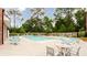 Community pool with chaise lounges and mature landscaping at 423 Burton Dr, Alpharetta, GA 30009