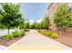 Enjoy paved walkways surrounded by lush landscaping for an active lifestyle within the neighborhood at 423 Burton Dr, Alpharetta, GA 30009