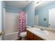 Cozy bathroom featuring bathtub with curtain, toilet, and a single-sink vanity at 6918 Gallant Se Cir # 22, Mableton, GA 30126