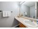 Bathroom with a single sink vanity and a large mirror at 6918 Gallant Se Cir # 22, Mableton, GA 30126