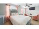 Comfortable bedroom with a queen-sized bed, ceiling fan, and cozy seating area at 6918 Gallant Se Cir # 22, Mableton, GA 30126