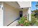 Inviting front door entrance with colorful floral landscaping and a covered porch at 6918 Gallant Se Cir # 22, Mableton, GA 30126