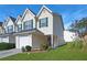 Inviting two-story townhome with a one-car garage and manicured landscaping at 6918 Gallant Se Cir # 22, Mableton, GA 30126