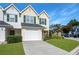 Two-story townhome featuring a one-car garage and a well-maintained lawn at 6918 Gallant Se Cir # 22, Mableton, GA 30126