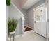 Bright foyer featuring stairs with wooden treads and white tile flooring at 6918 Gallant Se Cir # 22, Mableton, GA 30126