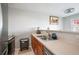 Well-lit kitchen featuring stainless steel appliances, double sink, and light countertops at 6918 Gallant Se Cir # 22, Mableton, GA 30126