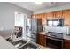 Well-lit kitchen featuring stainless steel appliances and wood cabinets, creating a modern and functional cooking space at 6918 Gallant Se Cir # 22, Mableton, GA 30126