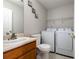 Functional laundry area featuring a sink, toilet, washer, and dryer at 6918 Gallant Se Cir # 22, Mableton, GA 30126
