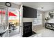 Cozy living room featuring a fireplace, mounted TV, and access to an outdoor patio at 6918 Gallant Se Cir # 22, Mableton, GA 30126