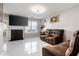 Comfortable living room with fireplace, large TV, and leather furniture at 6918 Gallant Se Cir # 22, Mableton, GA 30126