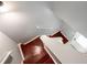 View of stained wooden staircase with white risers and gray walls at 6918 Gallant Se Cir # 22, Mableton, GA 30126