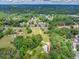 Expansive aerial view captures a blend of residential areas, lush greenery, and commercial development at 743 New Hope Rd, Lawrenceville, GA 30046