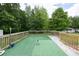 Backyard deck with artificial turf, wood railing, and space for outdoor enjoyment at 743 New Hope Rd, Lawrenceville, GA 30046
