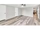 Bedroom shows wood-look floors, and access to the kitchen with a view of a dining area at 743 New Hope Rd, Lawrenceville, GA 30046