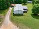 Rear aerial view of the home showing a deck, shed, and covered parking at 743 New Hope Rd, Lawrenceville, GA 30046