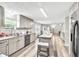 Bright kitchen with gray cabinets, stainless steel appliances, and a center island with seating at 743 New Hope Rd, Lawrenceville, GA 30046