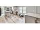 A large kitchen with stainless steel appliances, countertops, and large windows with natural light at 743 New Hope Rd, Lawrenceville, GA 30046
