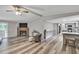 Open-concept living room boasts hardwood floors, a stone fireplace, and seamless flow to the modern kitchen at 743 New Hope Rd, Lawrenceville, GA 30046