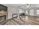 Cozy living room with hardwood floors, stone fireplace, neutral color palette, and plenty of natural light at 743 New Hope Rd, Lawrenceville, GA 30046