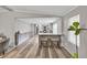 The hardwood floors and neutral color palette add elegance to this living space leading to the kitchen at 743 New Hope Rd, Lawrenceville, GA 30046