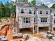 New townhomes under construction with exposed brick and Kingspan GreenGuard weather resistant barrier at 2 Rock Park Way # 13, Tucker, GA 30084