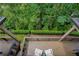 An aerial view of a wooden porch and a lush landscape at 385 Windy Pines Trl, Roswell, GA 30075