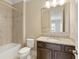 Elegant bathroom featuring granite countertops, tile flooring, and a shower/tub combo at 385 Windy Pines Trl, Roswell, GA 30075