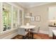 Bright breakfast nook featuring table and chairs next to large windows at 385 Windy Pines Trl, Roswell, GA 30075