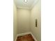 Interior of home elevator featuring wood floors, neutral walls, and control panel at 385 Windy Pines Trl, Roswell, GA 30075
