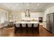 Modern kitchen with stainless steel appliances, large island, and open layout at 385 Windy Pines Trl, Roswell, GA 30075