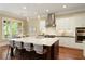 Contemporary kitchen with stainless appliances, central island and bar stool seating at 385 Windy Pines Trl, Roswell, GA 30075